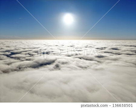 Serene Highaltitude Sky Scene, Peaceful Atmosphere With Sunlit Clouds Blending Into Clear Blue 136638501