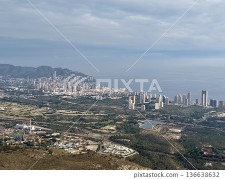 Aerial View Capturing Seaside City With Dense Skyscraper Clusters And Harbor Activities Under Cloudy Sky Aerial View Capturing Seaside City With Dense Skyscraper Clusters And Harbor Activities Under Cloudy Sky 136638632