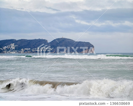 Distant Island With Wild Surf, Scenic Coastline Featuring Turbulent Waters And Serene Sky Backdrop Distant Island With Wild Surf, Scenic Coastline Featuring Turbulent Waters And Serene Sky Backdrop 136638669