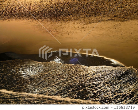 Rocky Waters With Shimmering Sand, Shallow Basin Of Mirror Water Surrounded By Rugged Ridges And Sand 136638719