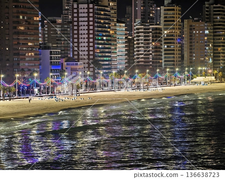 Nighttime Beach Walk With Lively Crowd, Celebratory Coastal Walk Among Palm Trees And Vibrant Lights Nighttime Beach Walk With Lively Crowd, Celebratory Coastal Walk Among Palm Trees And Vibrant Lights 136638723