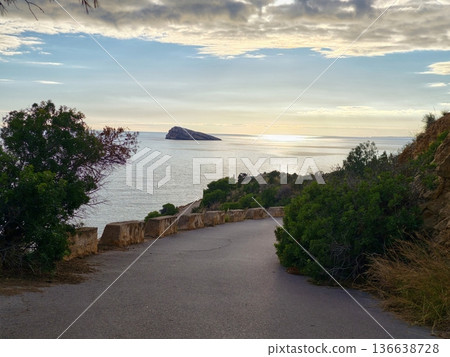 Winding Seaside Road Leads To Sunset Outlook, Serpentine Coastal Highway Frames Sunset With Natural Beauty Winding Seaside Road Leads To Sunset Outlook, Serpentine Coastal Highway Frames Sunset With Natural Beauty 136638728