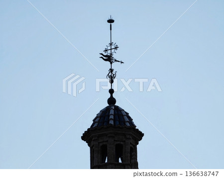 Silhouette Over Subdued Sky, Architectural Structure Featuring Crowning Iron Ornament And Simple Design 136638747