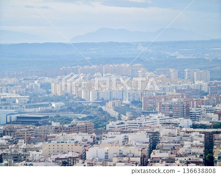Cityscape With Harbor And Hills, Coastal Urban Skyline Featuring Apartment Clusters And Harbor Views 136638808