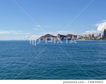 Cityscape With Seashore Panorama, Expansive Coastal Scene Displaying City Silhouette And Rocky Promontory Cityscape With Seashore Panorama, Expansive Coastal Scene Displaying City Silhouette And Rocky Promontory 136638842