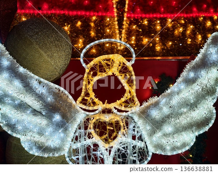 Brilliant Angel Scene, Luminous Angel Display With Golden Halo And Festive Crowd Attraction At Night Brilliant Angel Scene, Luminous Angel Display With Golden Halo And Festive Crowd Attraction At Night 136638881