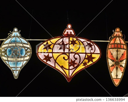 Decorative Glass Lamps Illuminate Evening, Handcrafted Mosaic Lanterns Create Warm Festive Market Ambiance Decorative Glass Lamps Illuminate Evening, Handcrafted Mosaic Lanterns Create Warm Festive Market Ambiance 136638994