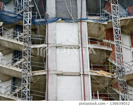 Construction Site With Weathered Structures, Cityscape With Scaffolding And Worn Building Facade 136639052