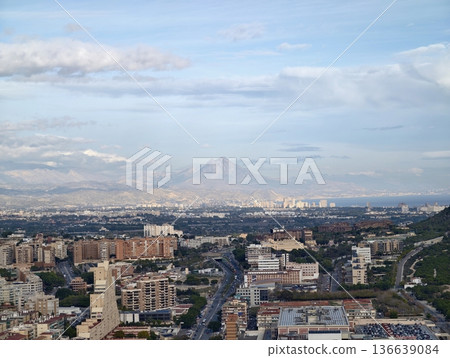 Early Morning Urban Scene Featuring Mountain Background And Tranquil City Rooftops In Soft Light Early Morning Urban Scene Featuring Mountain Background And Tranquil City Rooftops In Soft Light 136639084