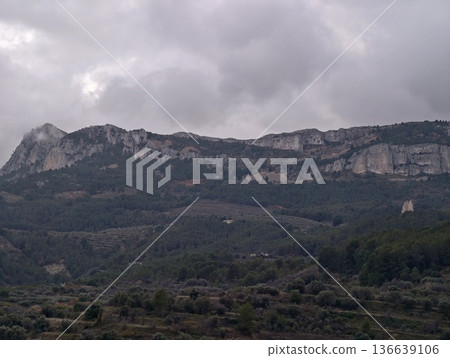 Gloomy Mountain Chain Cloaked In Heavy Fog Towers Over Thriving Forest Landscapes Perfect For Adventure Gloomy Mountain Chain Cloaked In Heavy Fog Towers Over Thriving Forest Landscapes Perfect For Adventure 136639106