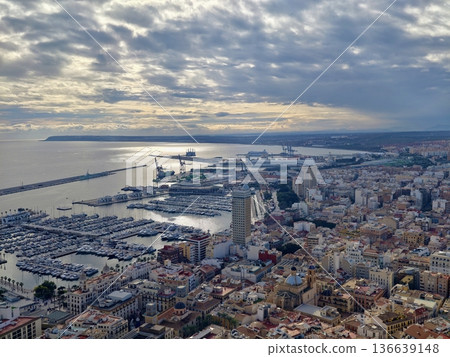 Sunset Over Harbor And Cityscape Views, Dusk Illuminates City Skyline And Harbor With Glowing Colors 136639148