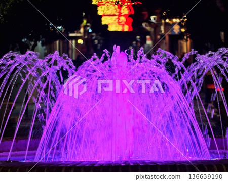 Nighttime Fountain Spectacle Showcases Luminous Jets And Reflections Creating Lively Urban Scene Nighttime Fountain Spectacle Showcases Luminous Jets And Reflections Creating Lively Urban Scene 136639190