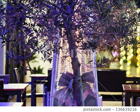 Vivid Purple And Gold Decor Setting, Warm Ambient Lighting Enhances Intimate Dining Experience Vivid Purple And Gold Decor Setting, Warm Ambient Lighting Enhances Intimate Dining Experience 136639216