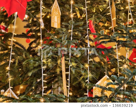 Handmade Ornaments Enhance Holiday Atmosphere, Seasonal Display Features Rustic Wooden Ornaments And Lights 136639219