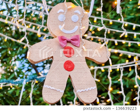 Festive Holiday Decoration, Decorative Holiday Piece Featuring Smiling Gingerbread Man With Lights And Ribbons Festive Holiday Decoration, Decorative Holiday Piece Featuring Smiling Gingerbread Man With Lights And Ribbons 136639223
