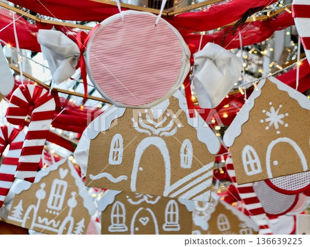 Decorative Holiday Ornaments, String Of Gingerbread House Ornaments With Candies And Icing Patterns Decorative Holiday Ornaments, String Of Gingerbread House Ornaments With Candies And Icing Patterns 136639225