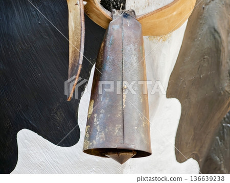 Rustic Farm Sound, Vivid Depiction Of Cow Bell Hanging From Leather Straps Amidst Rustic Farm Surroundings Rustic Farm Sound, Vivid Depiction Of Cow Bell Hanging From Leather Straps Amidst Rustic Farm Surroundings 136639238