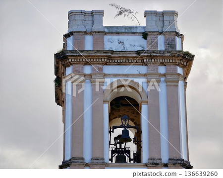 Historic Structure With Classical Features, Weathered Facade Showcasing Traditional Columns And Bell Historic Structure With Classical Features, Weathered Facade Showcasing Traditional Columns And Bell 136639260