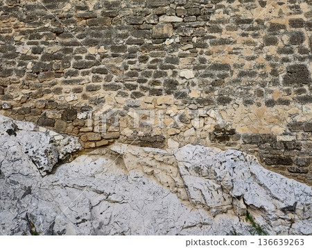 Textured Rocky Foreground With Ancient Wall, Closeup Of Stratified Rocks Against Fortress Wall Texture 136639263