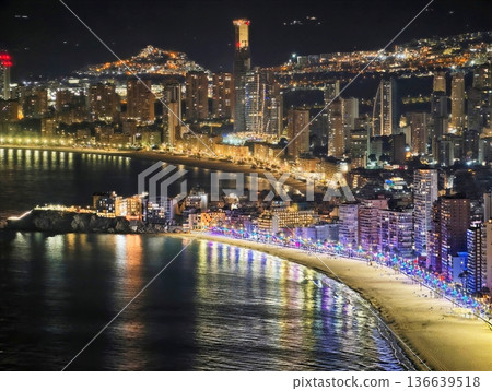 Nighttime Harbor View Showcasing Shimmering Bridge Lights And Tranquil Water Reflections Beneath City Towers 136639518