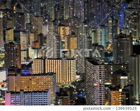Vivid Urban Night Scene, Photograph Of Bustling City Skyline With Neon Lights And Tall Buildings Vivid Urban Night Scene, Photograph Of Bustling City Skyline With Neon Lights And Tall Buildings 136639528