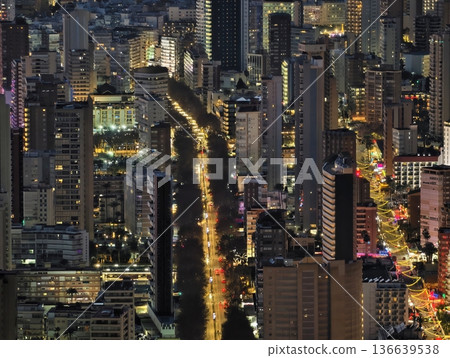 High Vantage Point Displaying Lively Metropolis With Glowing Streets And Tall Structures After Sunset 136639538