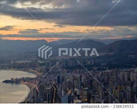 Sunset Mountains Contrast, Serene Landscape Featuring Mountain Silhouettes And Tranquil Sea Under Sunset Glow Sunset Mountains Contrast, Serene Landscape Featuring Mountain Silhouettes And Tranquil Sea Under Sunset Glow 136639551