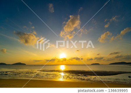 Landscape view of majestic clouds in the sky sunset or sunrise over sea with reflection in the tropical sea,Beautiful cloudscape scenery,Amazing light of nature Landscape nature background Landscape view of majestic clouds in the sky sunset or sunrise over sea with reflection in the tropical sea,Beautiful cloudscape scenery,Amazing light of nature Landscape nature background 136639995