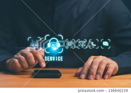 Businessman using digital interface for 24/7 online customer service and AI chatbot support, representing technology communication, virtual assistance, and professional help desk solutions. Businessman using digital interface for 24/7 online customer service and AI chatbot support, representing technology communication, virtual assistance, and professional help desk solutions. 136640239