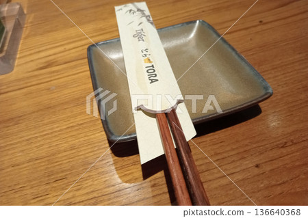 Chopsticks on a table at TORA Modern Izakaya Japanese Restaurant Chopsticks on a table at TORA Modern Izakaya Japanese Restaurant 136640368