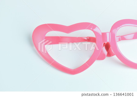 pink heart shape of glasses on white background 136641001