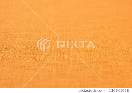 orange hemp viscose natural fabric cloth color, sackcloth rough texture of textile fashion orange hemp viscose natural fabric cloth color, sackcloth rough texture of textile fashion 136641038