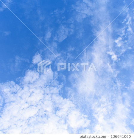 beautiful blue sky and white fluffy group of clouds with sunrise in the morning, natural background beautiful blue sky and white fluffy group of clouds with sunrise in the morning, natural background 136641060