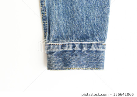 sleeve of blue denim shirt texture isolated on white background, jean fashion style 136641066