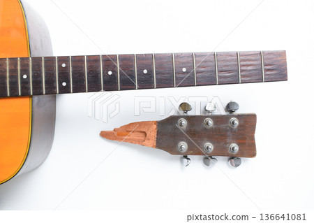 part of broken wood acoustic guitar isolated on white background 136641081