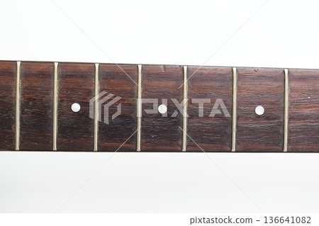 part of brown wood acoustic guitar isolated on white background part of brown wood acoustic guitar isolated on white background 136641082