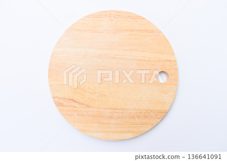 brown wooden sphere cuttingboard isolated on white background 136641091