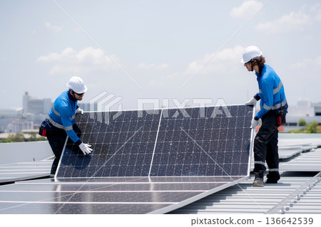 Caucasian worker team installing solar cell for sustainable energy power. Caucasian worker team installing solar cell for sustainable energy power. 136642539