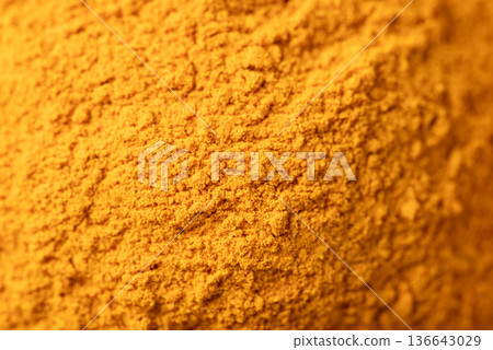 Close up of turmeric powder texture background. Organic healthy spice Close up of turmeric powder texture background. Organic healthy spice 136643029