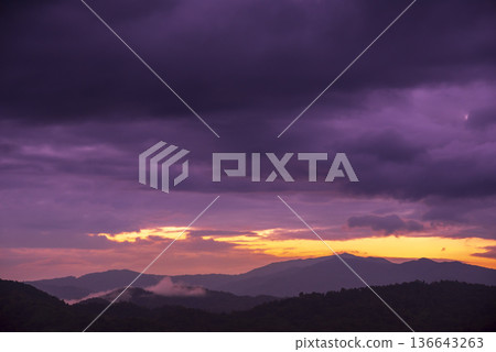 Violet purple sky in morning scenery Vibrant colorful blue sky summer time on sunrise. Natural beautiful landscape. Beauty purple sky romantic dramatic landscape cloudy outdoor paradise in sunset 136643263