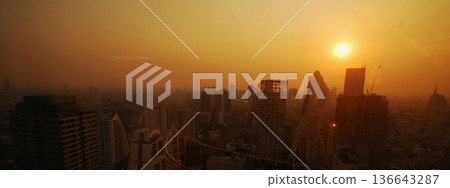 Sunset Amazing Bangkok city skyline with blue sky. Golden time Beautiful skyscraper bangkok midtown landscape. Capital building background modern office district. downtown City night life Sunset Amazing Bangkok city skyline with blue sky. Golden time Beautiful skyscraper bangkok midtown landscape. Capital building background modern office district. downtown City night life 136643287