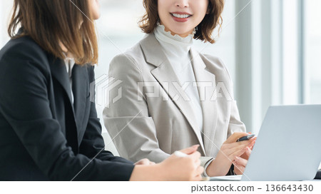 Two women/businesswomen having a meeting 136643430
