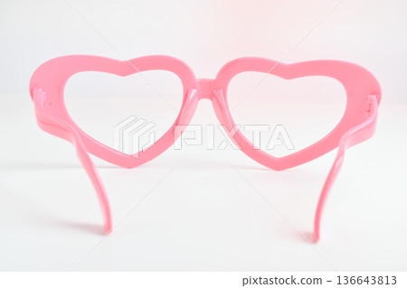 pink heart shape of glasses on white background 136643813