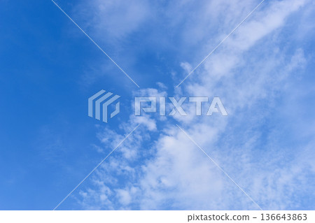 beautiful blue sky and white fluffy group of clouds with sunrise in the morning, natural background beautiful blue sky and white fluffy group of clouds with sunrise in the morning, natural background 136643863