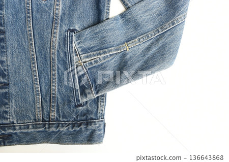 sleeve of blue denim shirt texture isolated on white background, jean fashion style 136643868