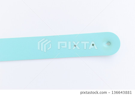 light blue leather strap isolated on white background 136643881