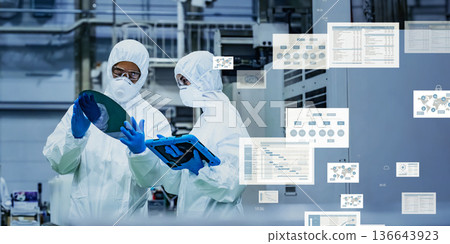 Group of engineers working in factory and digital data concept 136643923