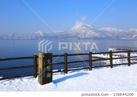 View of snow-capped Mount Eniwa from the shores of Lake Shikotsu View of snow-capped Mount Eniwa from the shores of Lake Shikotsu 136644206