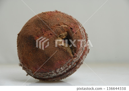 Old Cricket Ball closeup Old Cricket Ball closeup 136644338