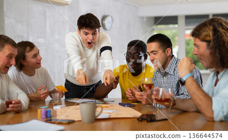 Group of men play board games 136644574